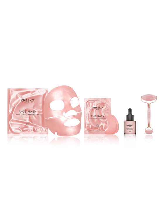 Knesko skincare product set including face mask, eye mask, serum, and roller on a white background