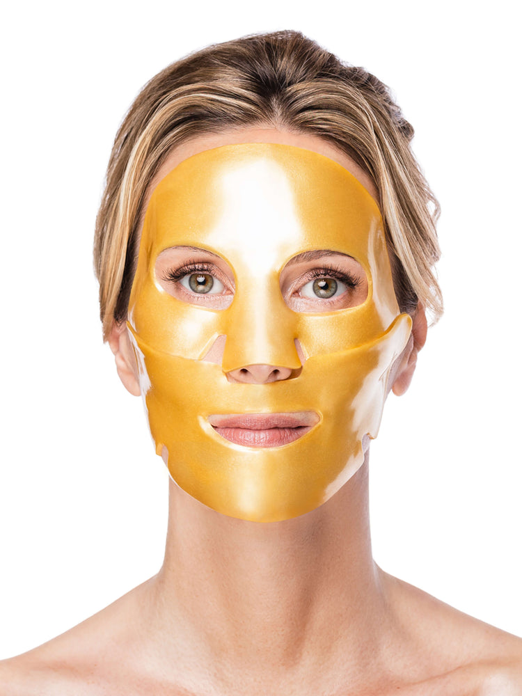 Woman wearing a gold face mask against a white background
