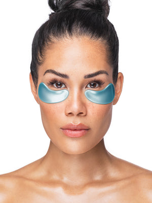 Woman wearing blue eye masks on a white background