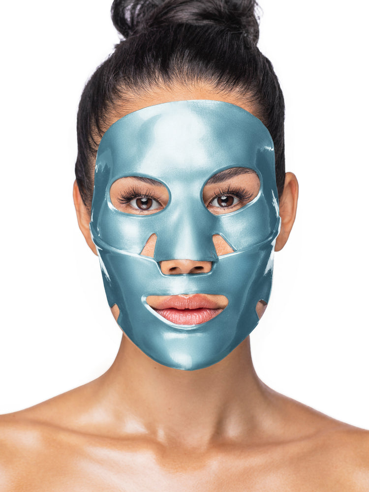 Woman wearing a blue face mask against a white background