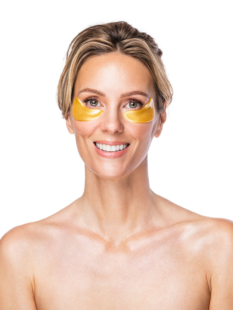 Woman wearing yellow eye masks on a white background