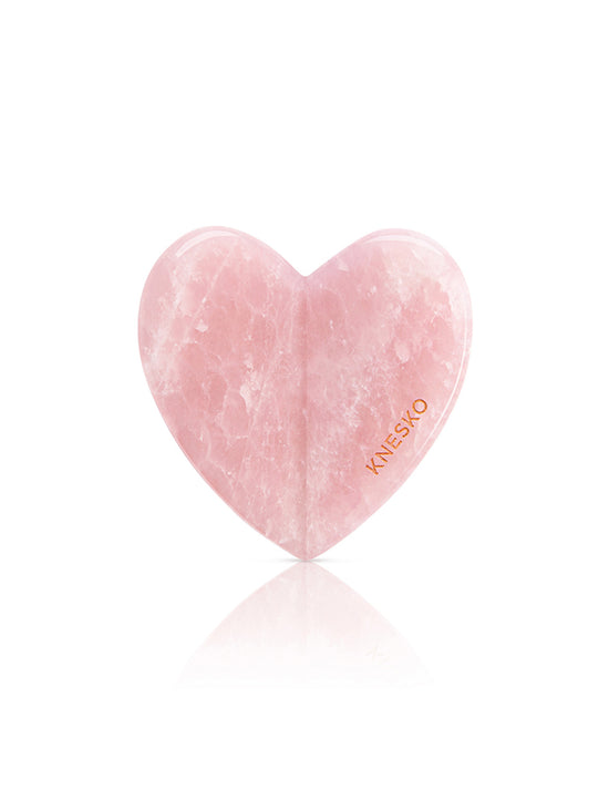 Heart-shaped pink product with 'Knesko' branding on a white background