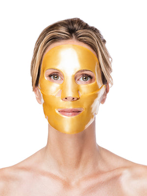 Woman wearing a gold face mask against a white background