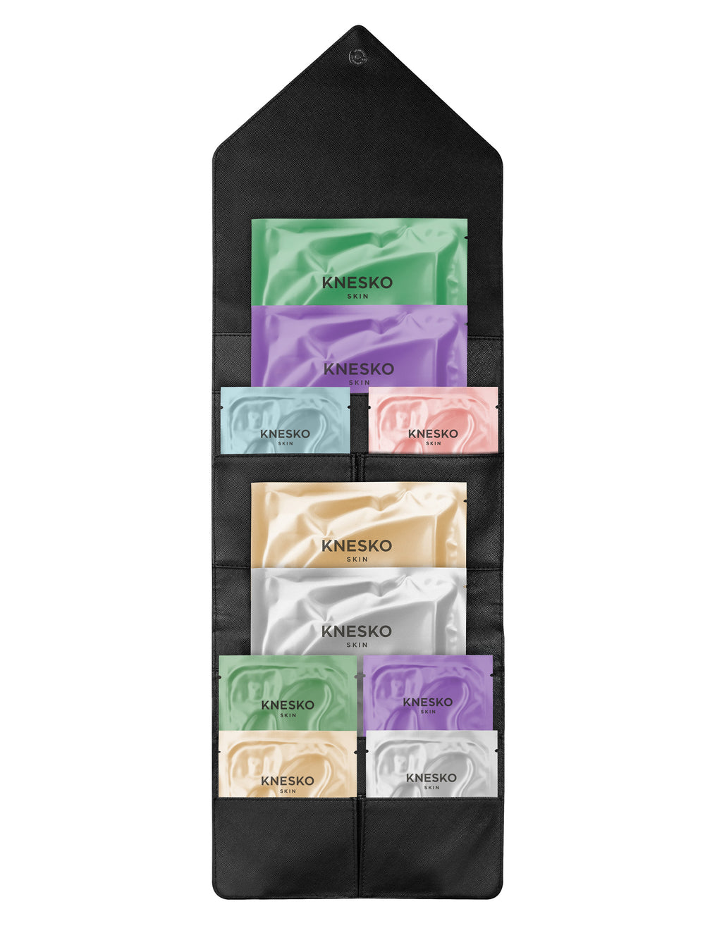 Set of Knesko skincare samples in a black holder on a white background