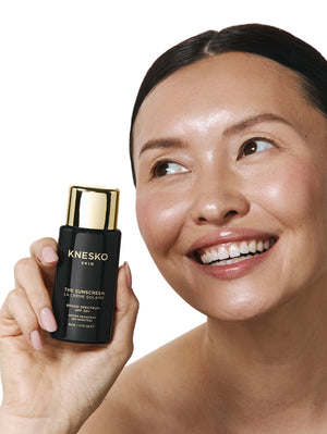 Woman holding a KNESKO product