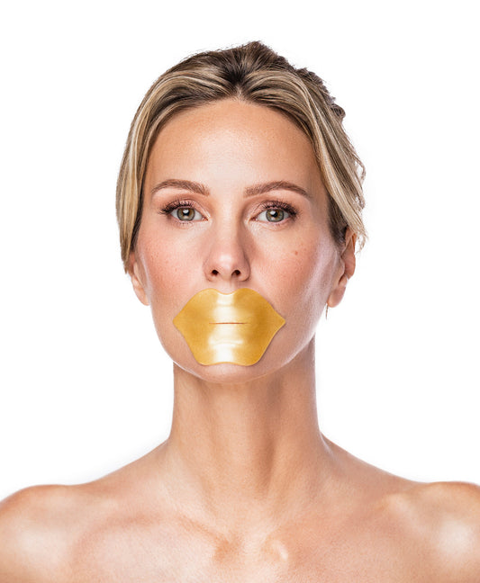 A woman using the Nano Gold Repair Lip Mask.
