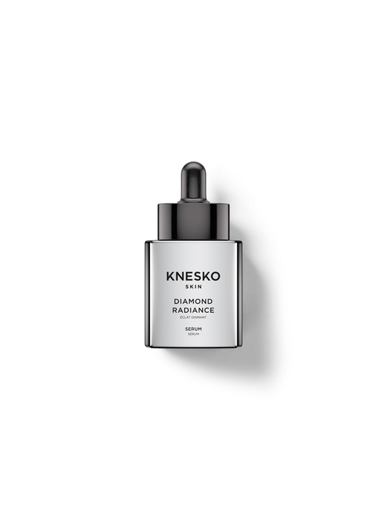 Knesko Skin Diamond Radiance Serum in a sleek silver rectangular bottle with a black dropper cap, centered on a clean white background with a soft shadow.
