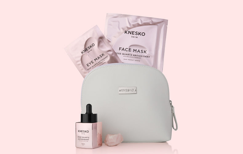 Knesko skincare products including face mask, eye mask, and serum on a pink background