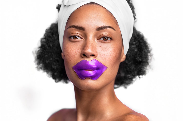 Woman wearing a purple lip mask on a white background