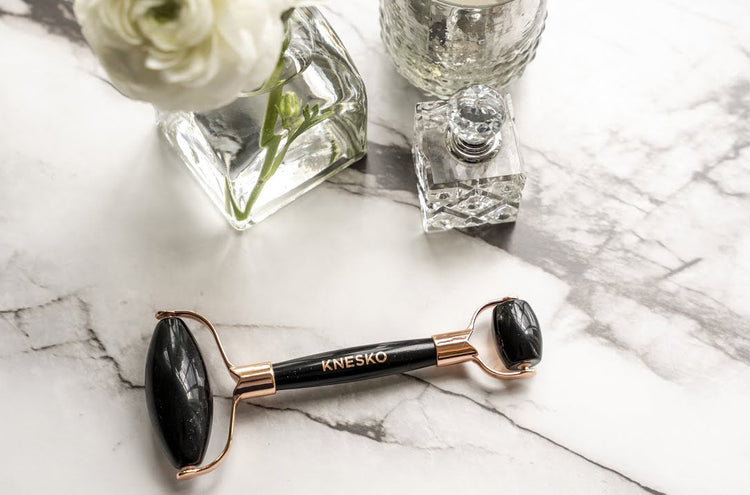 Obsidian gemstone roller.