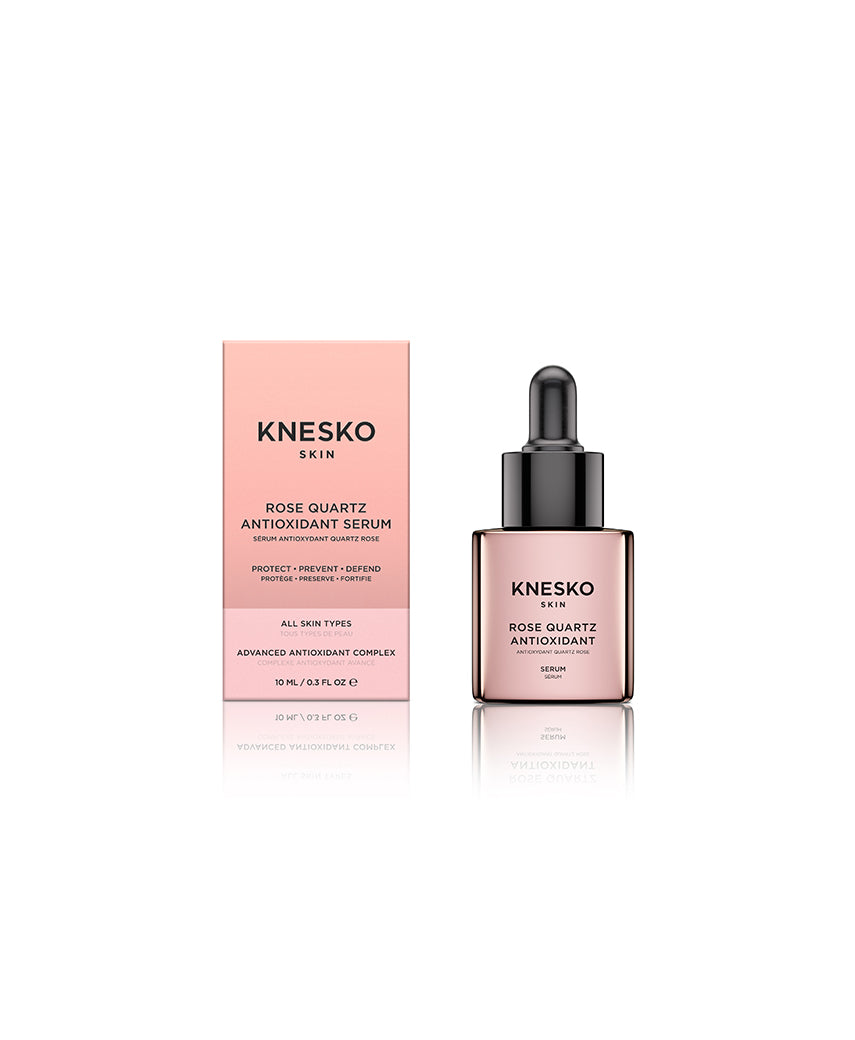 pink serum bottle that says knesko skin rose quartz antioxidant serum next to box.