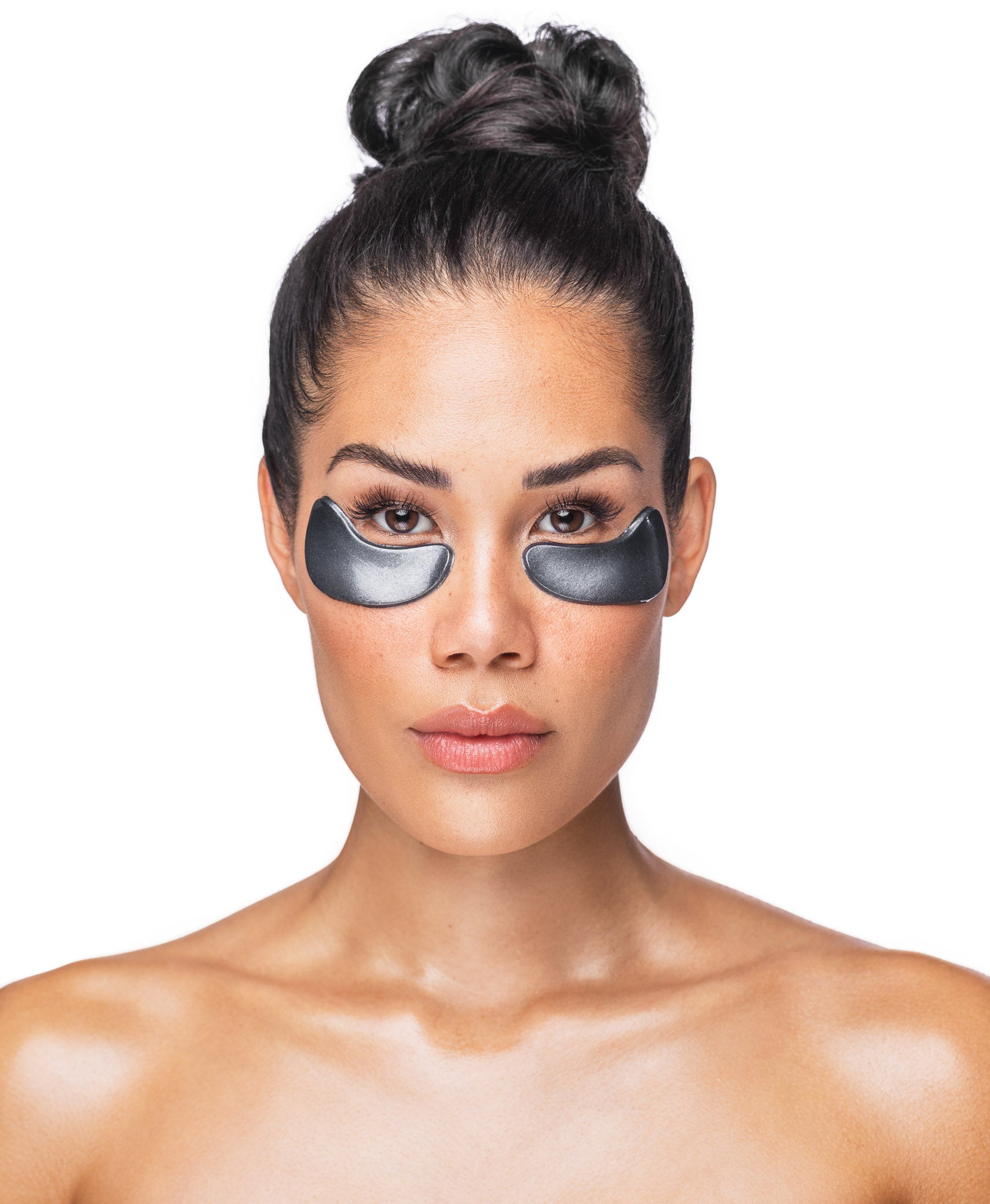A woman using a Black Pearl Detox Collagen Eye Mask.