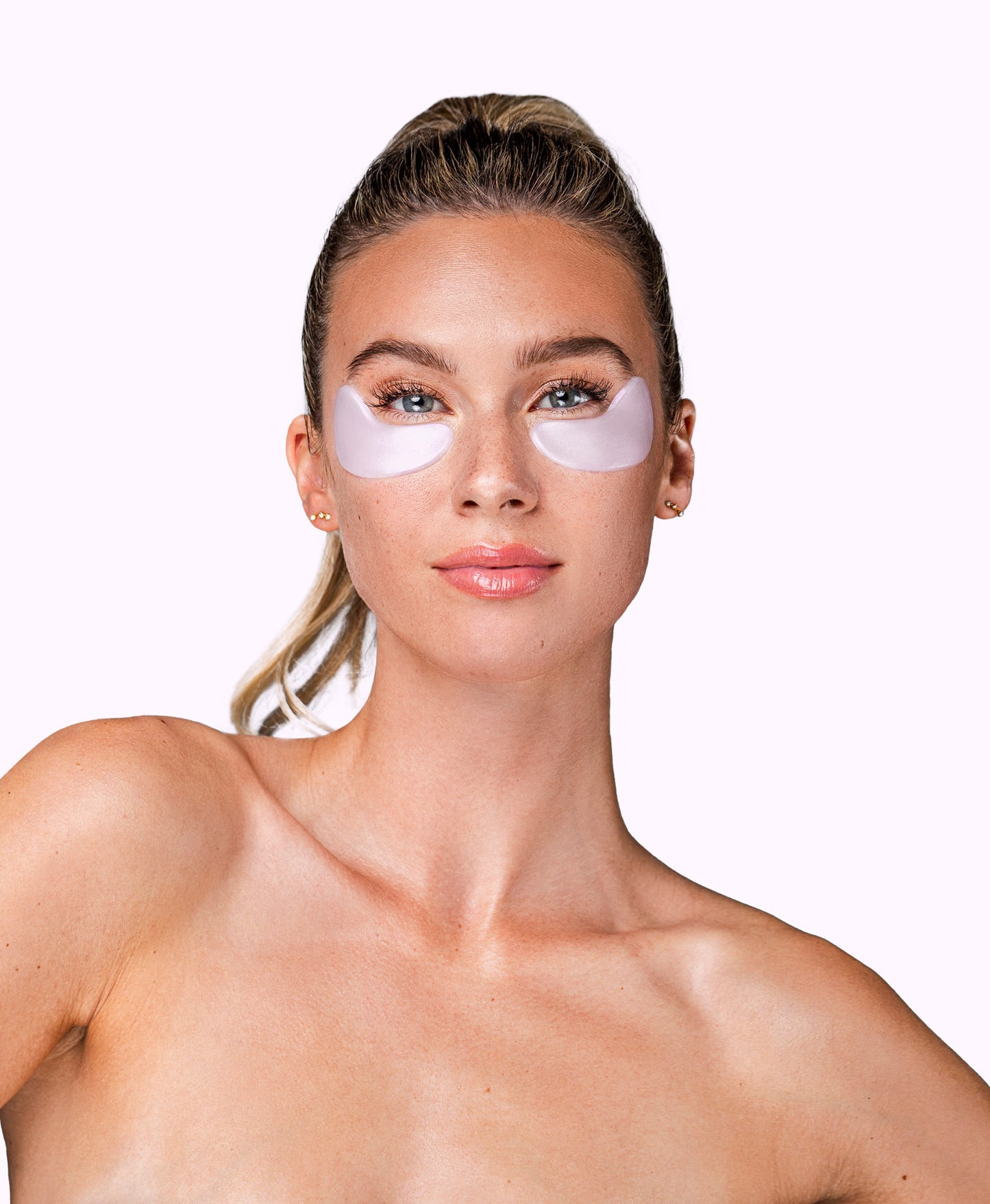 A woman using a Diamond Radiance Collagen Eye Mask.