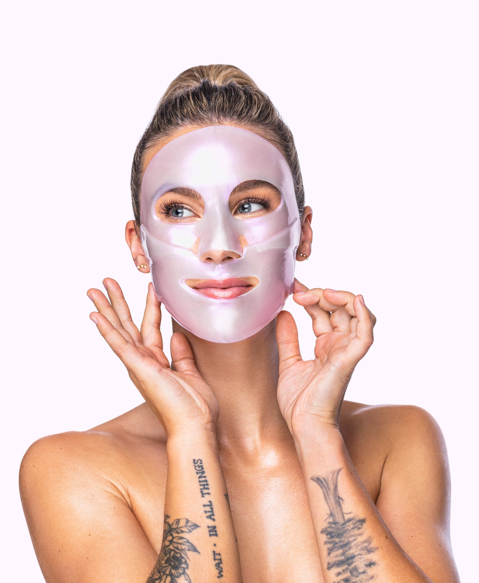 A woman using a Diamond Radiance Collagen Face Mask.