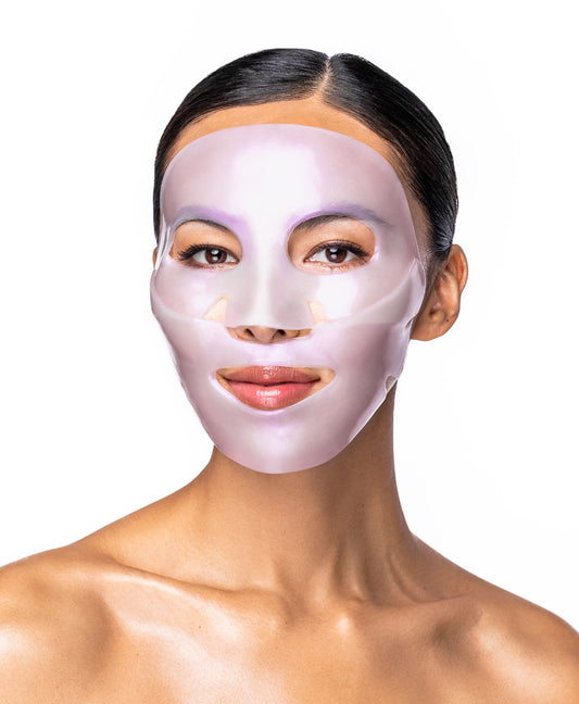 A woman using a Diamond Radiance Collagen Face Mask.