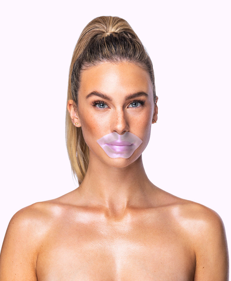 A woman using a Diamond Radiance Lip Mask.