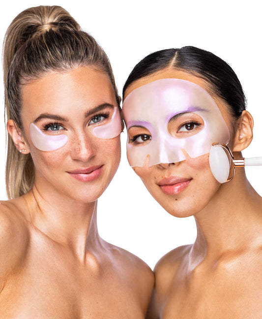 Two women using the Diamond Radiance Collagen Mask & White Jade Gemstone Roller Discovery Kit.