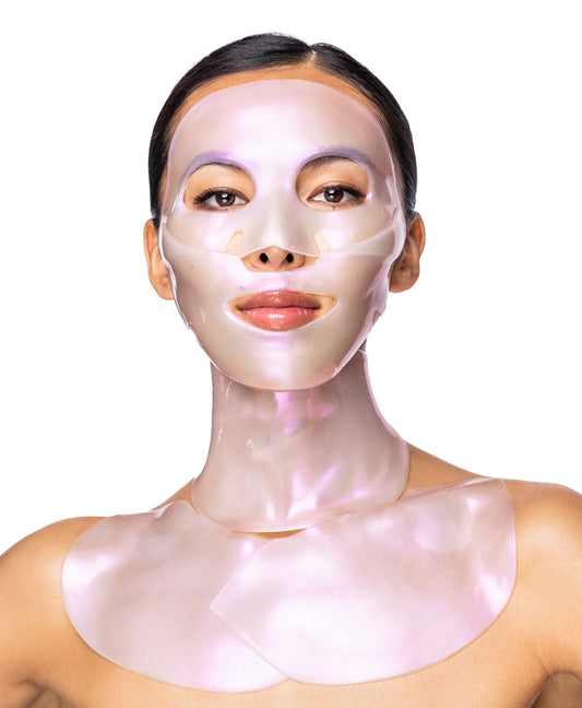 A woman using a Diamond Radiance Collagen Multi Masking Kit.