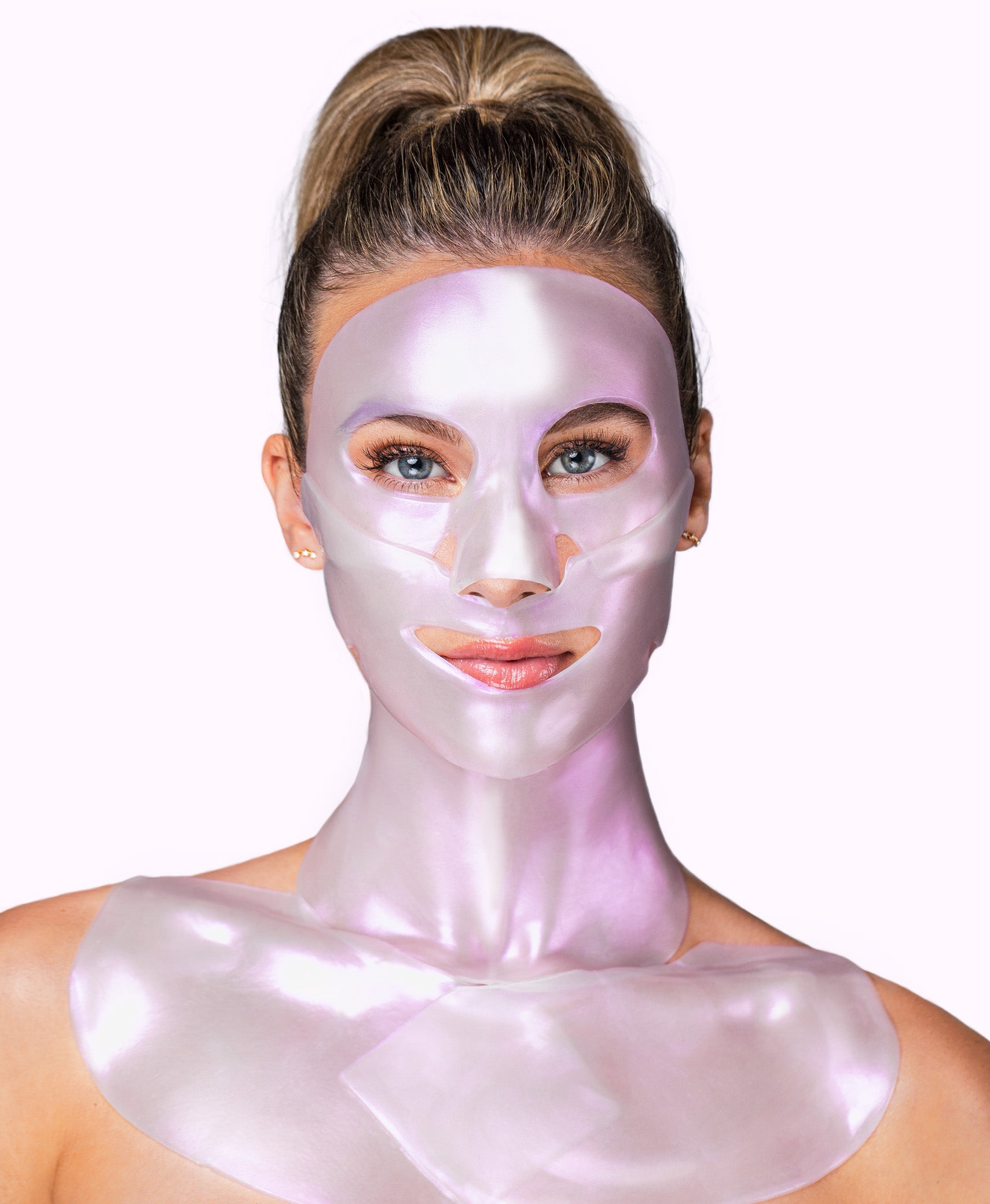 A woman using a Diamond Radiance Collagen Multi Masking Kit.
