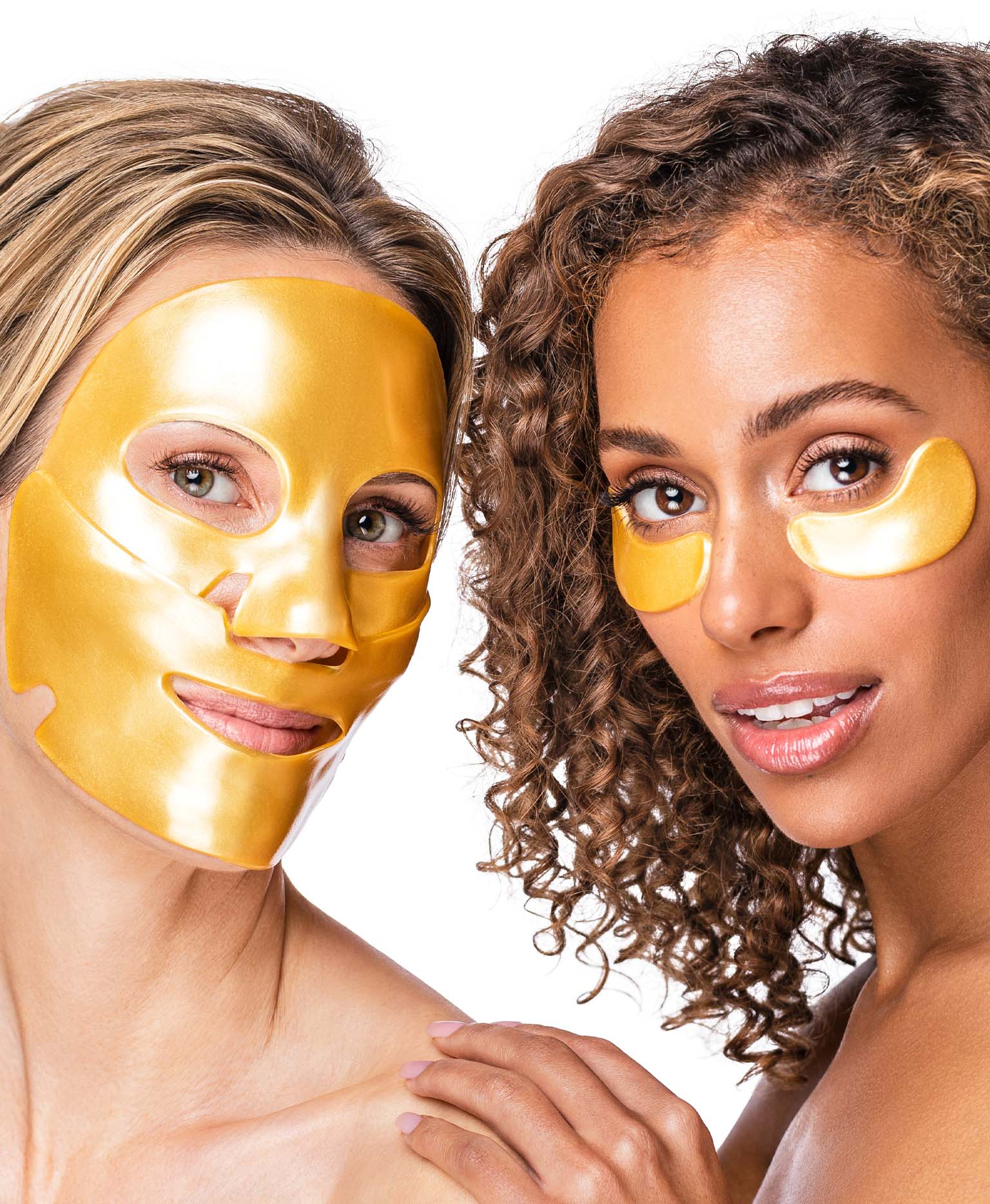 Two women using masks from the Nano Gold Repair Collagen Mask & Green Jade Gemstone Roller Set.