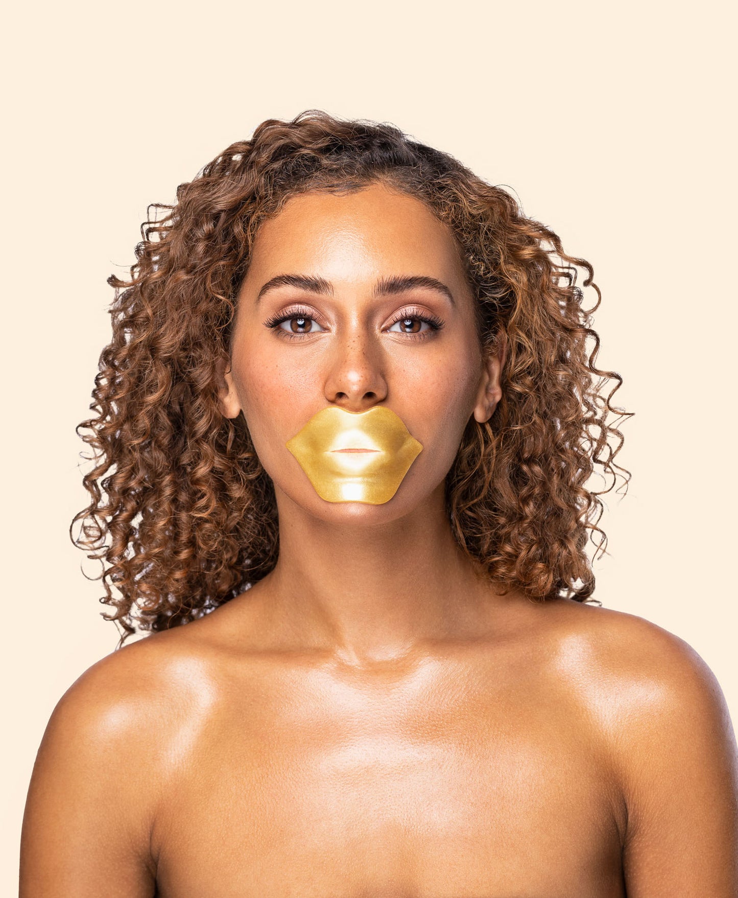 A woman using the Nano Gold Repair Lip Mask.