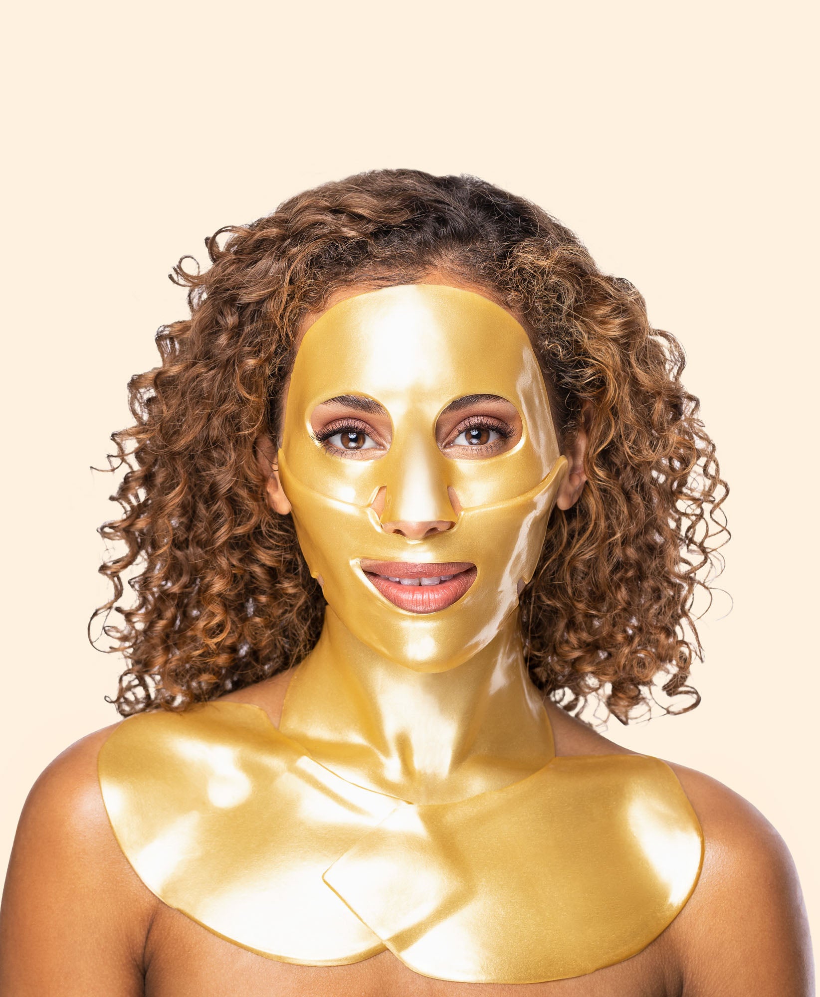 A woman using a Nano Gold Repair Collagen Multi Masking Kit.